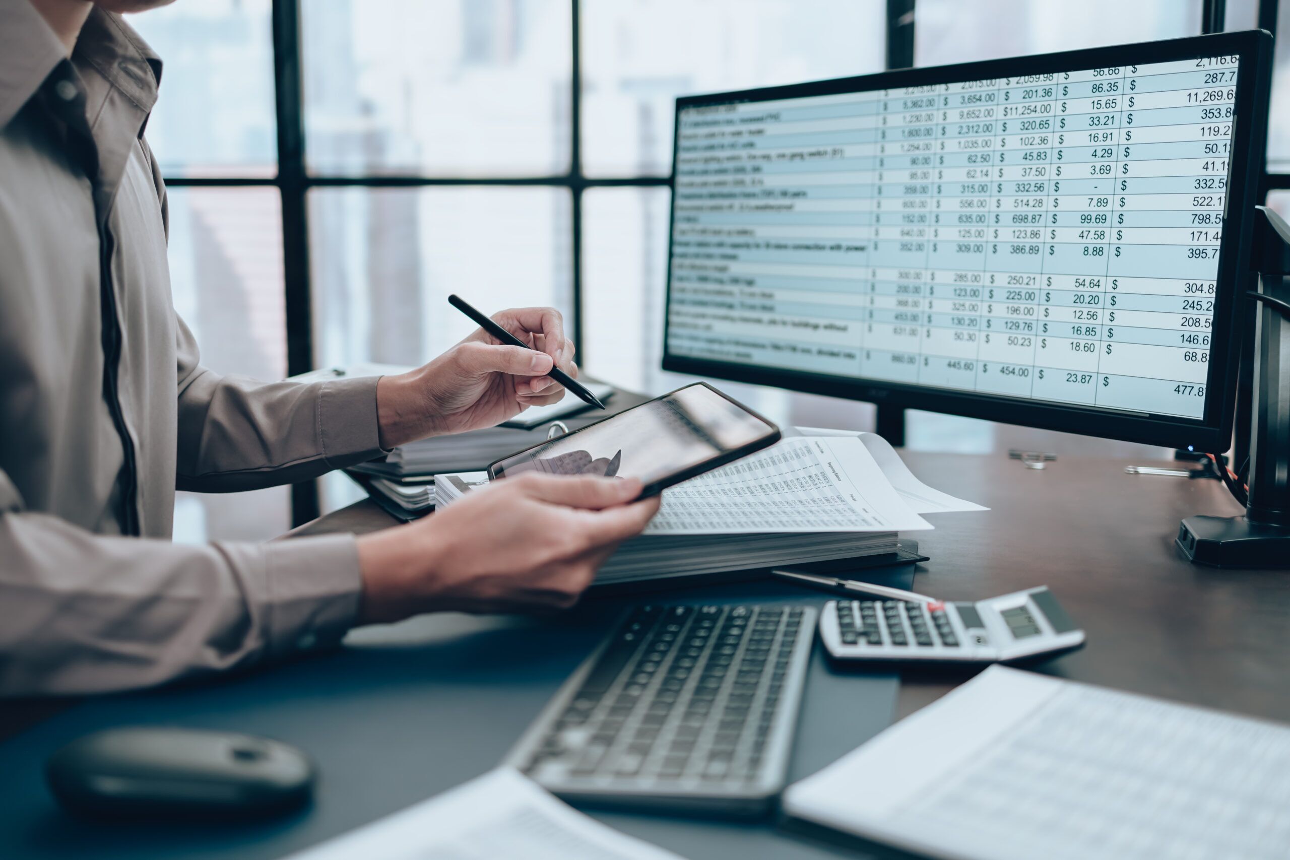 Investors working on desk office and use tablet to check tracki