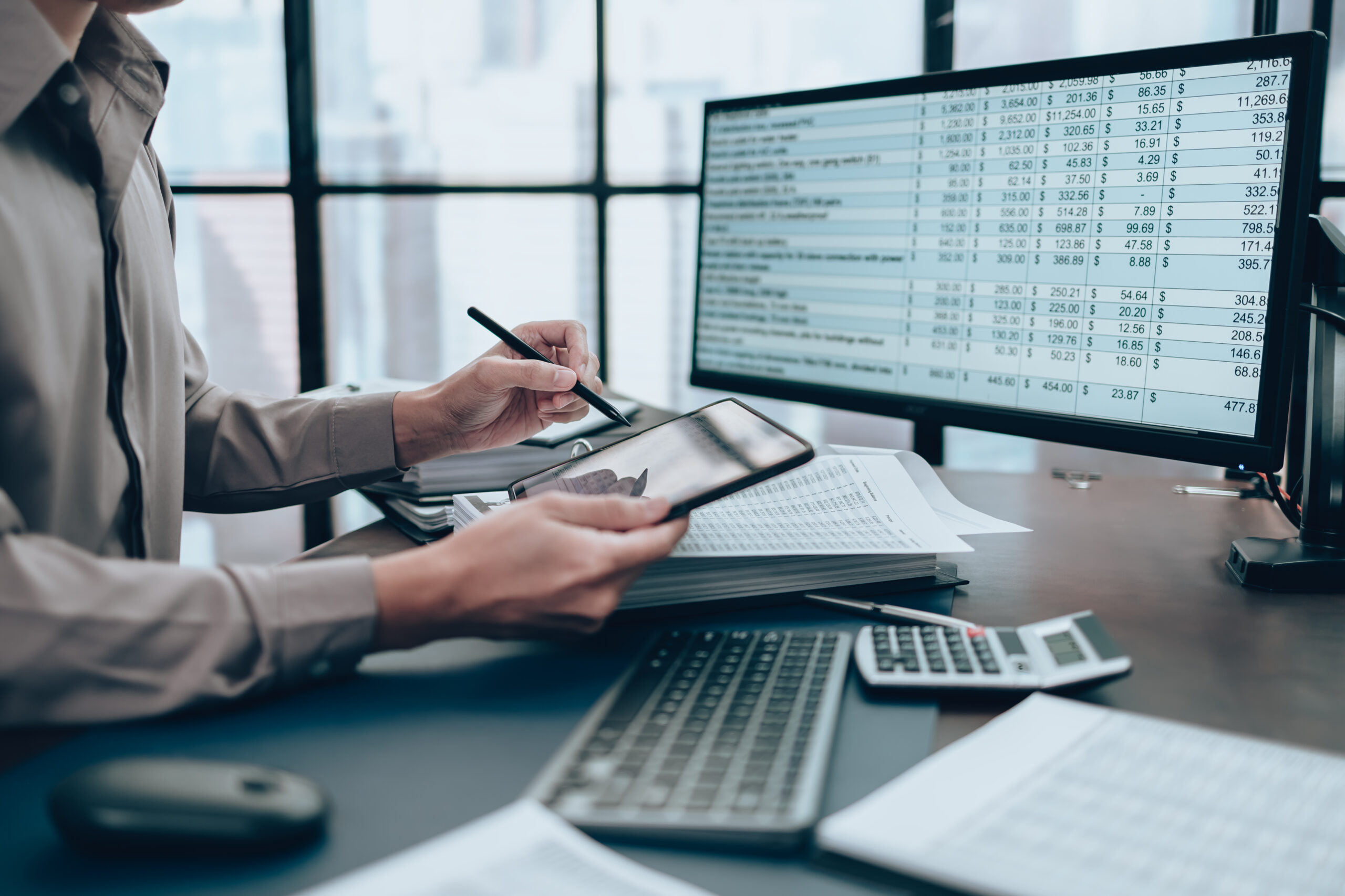 Investors working on desk office and use tablet to check tracki